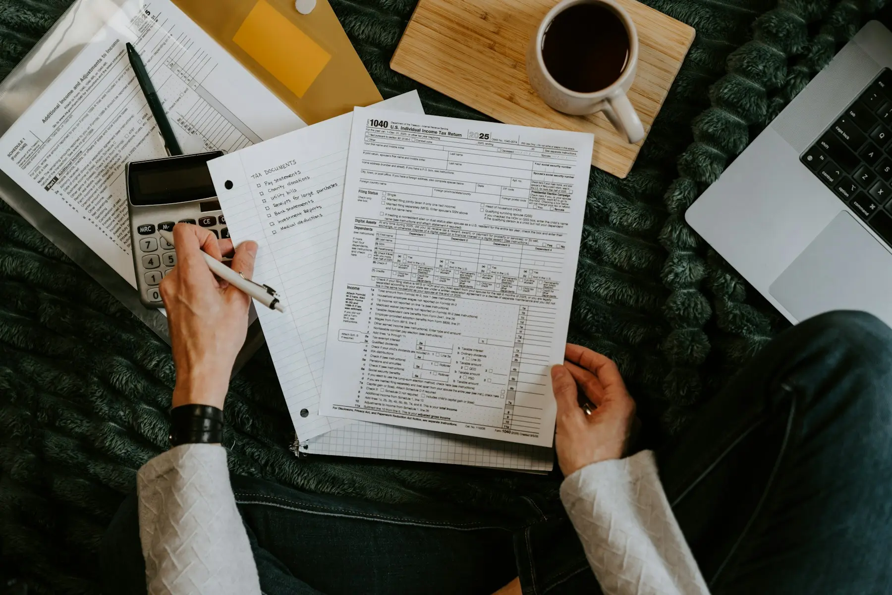 Professional checking documents with a calculator